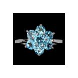 A Beautiful Natural Swiss Blue Topaz Ring, set with 7 Round cut African Blue Topaz - Size M.