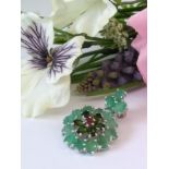 An Amazing AGI Certified very unique Brooch set with 15 Natural Brazilian Emerald Gemstones