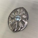 A vintage 925 silver Celtic design brooch with central topaz solitaire stone