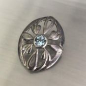 A vintage 925 silver Celtic design brooch with central topaz solitaire stone