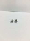 0.70ct diamond solitaire stud earrings set in platinum. I colour, si3 clarity. 3 claw setting with