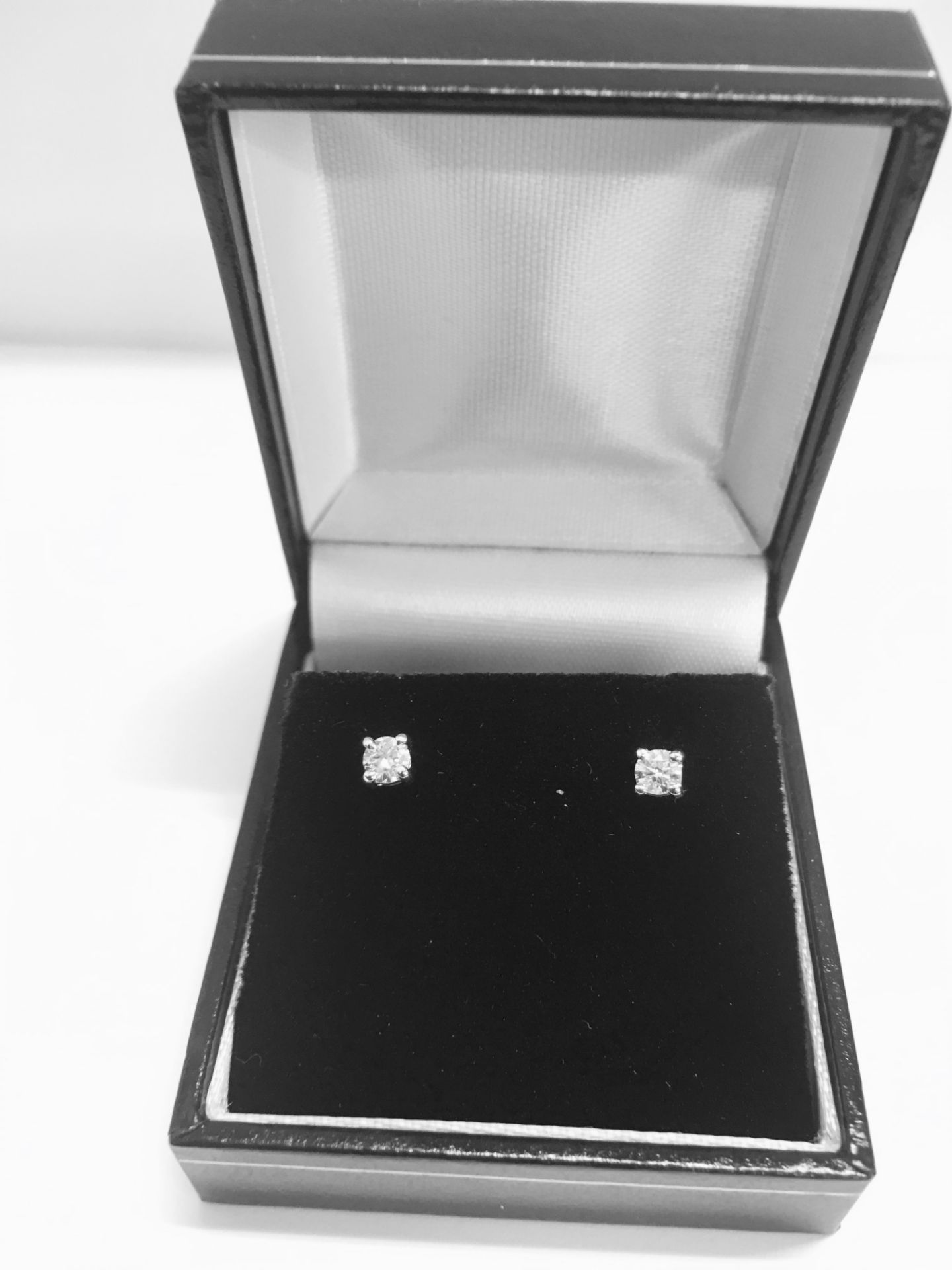 0.25ct diamond solitaire stud earrings set in platinum 950. Brilliant cut diamonds I colour, si2