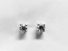 0.66ct Solitaire diamond stud earrings set with brilliant cut diamonds, i1 clarity and I colour. Set