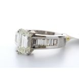 18ct White Gold Single Stone Claw Set Emerald Cut With Stone Set Shoulders Diamond Ring 2.90