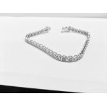 3.50ct tennis style bracelet set with brilliant cut diamonds. I colour, Si2 clarity. 18ct white