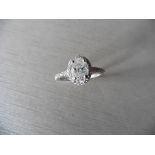 0.91ct oval diamond vs1 clarity,i colour,18ct white gold halo diamond setting,0.35 ct h colour si