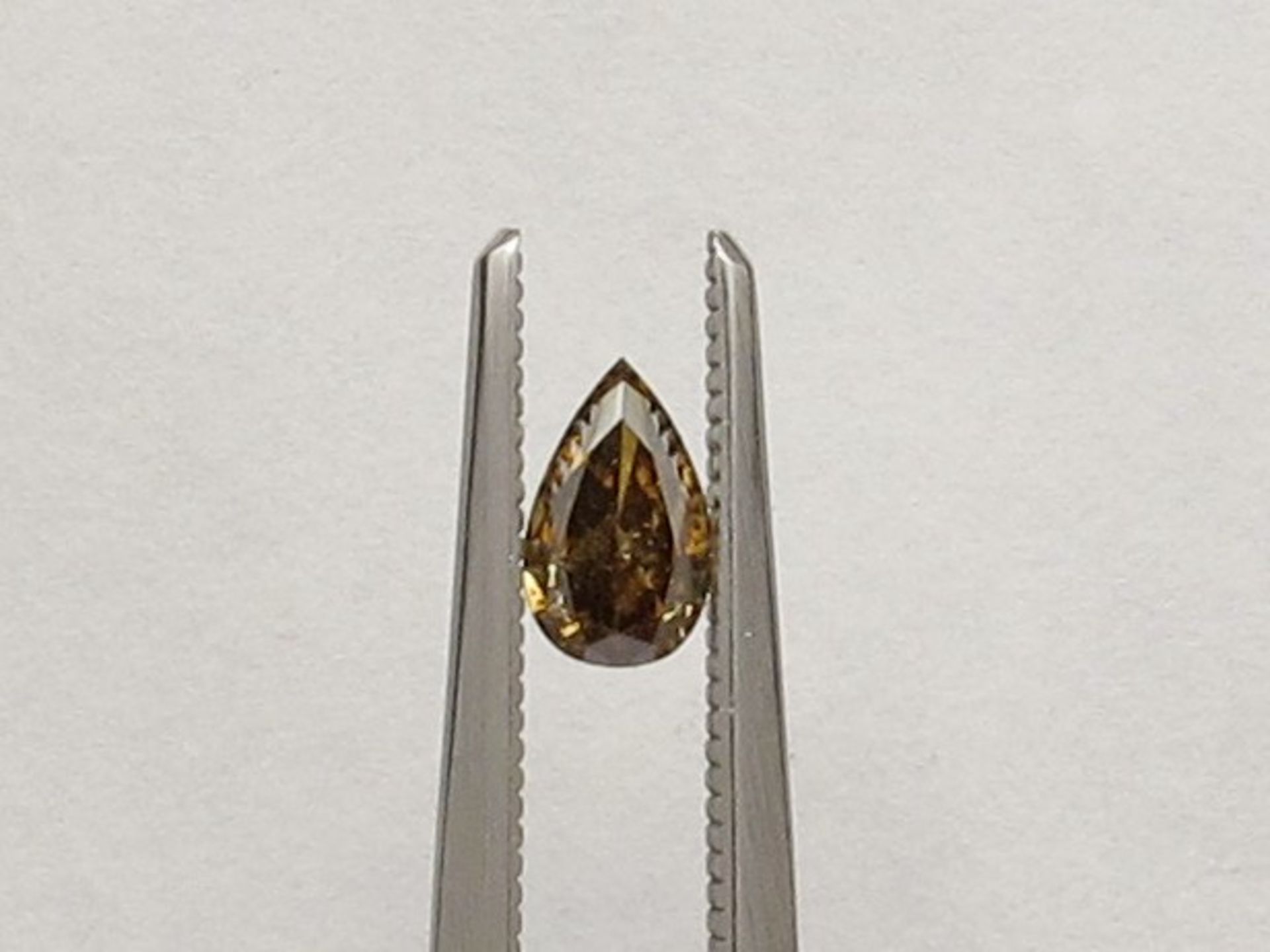 An unmounted Pear-shaped diamond weighing app. 0.43ct