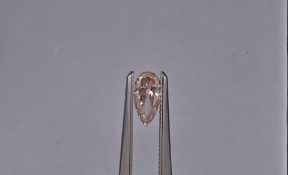 An unmounted Pear-shaped diamond weighing app. 0.43ct.