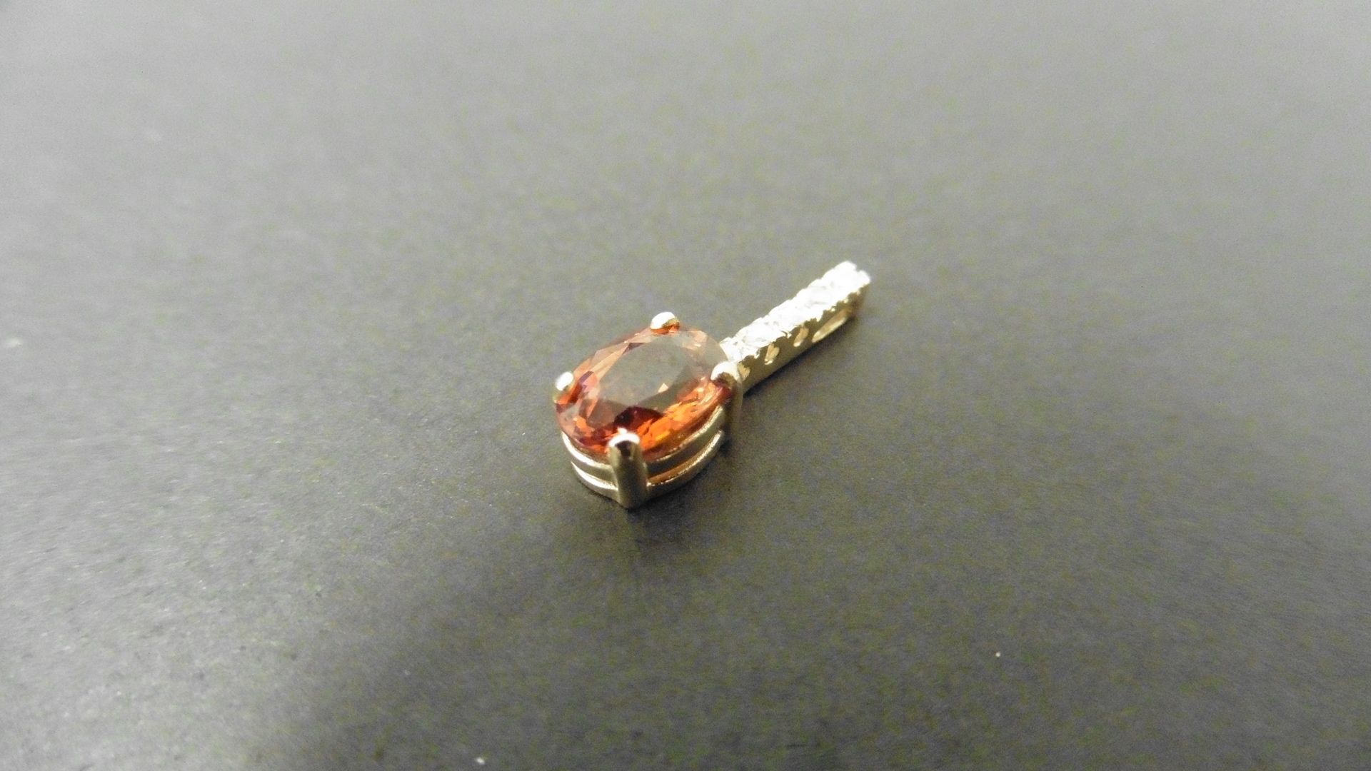 0.80ct citrine and diamond drop style pendant. 7X 5mm oval citrine set with 5 small brilliant cut - Image 2 of 3