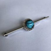 An antique Sterling Silver Bar Brooch with central Turquoise Stone