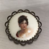 Antique Edwardian or Victorian brooch with painted porcelain portrait of a lady