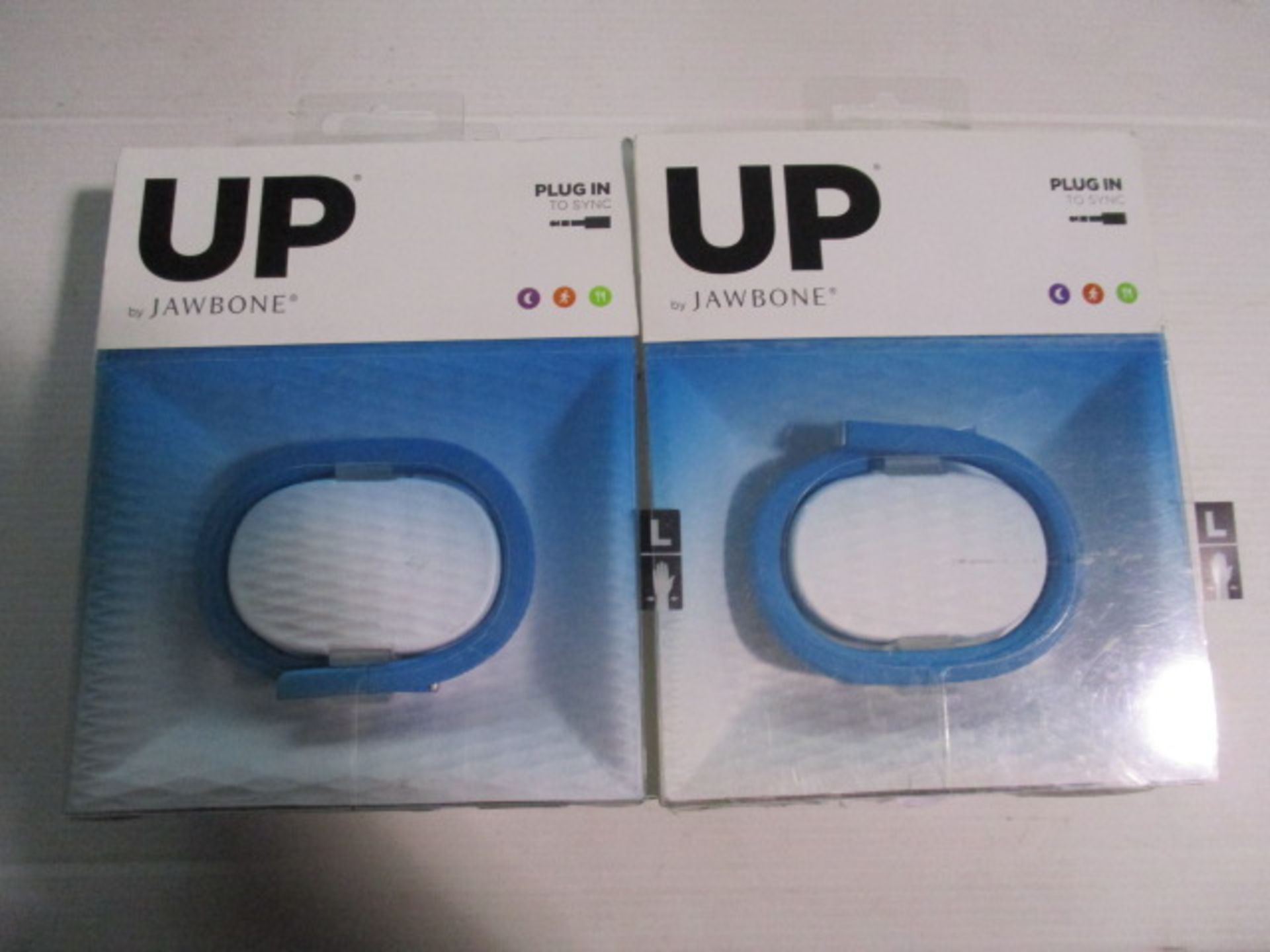 2 x UP by Jawbone systems as pictured boxed and unchecked