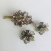 A vintage brooch and matching clip earrings in the Suffragette style of a posy of violets