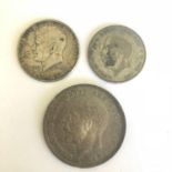 Group of three silver coins - 1964 US Half Dollar, 1923 GB Florin, 1935 GB Crown.