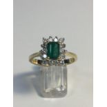 8ct gold Emerald cut emerald and Diamond ring