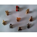 Collection of 9 Vintage Gold and Silver tone luxury designer perfume pins/brooches
