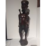 lot 128 Tribal hunting carving