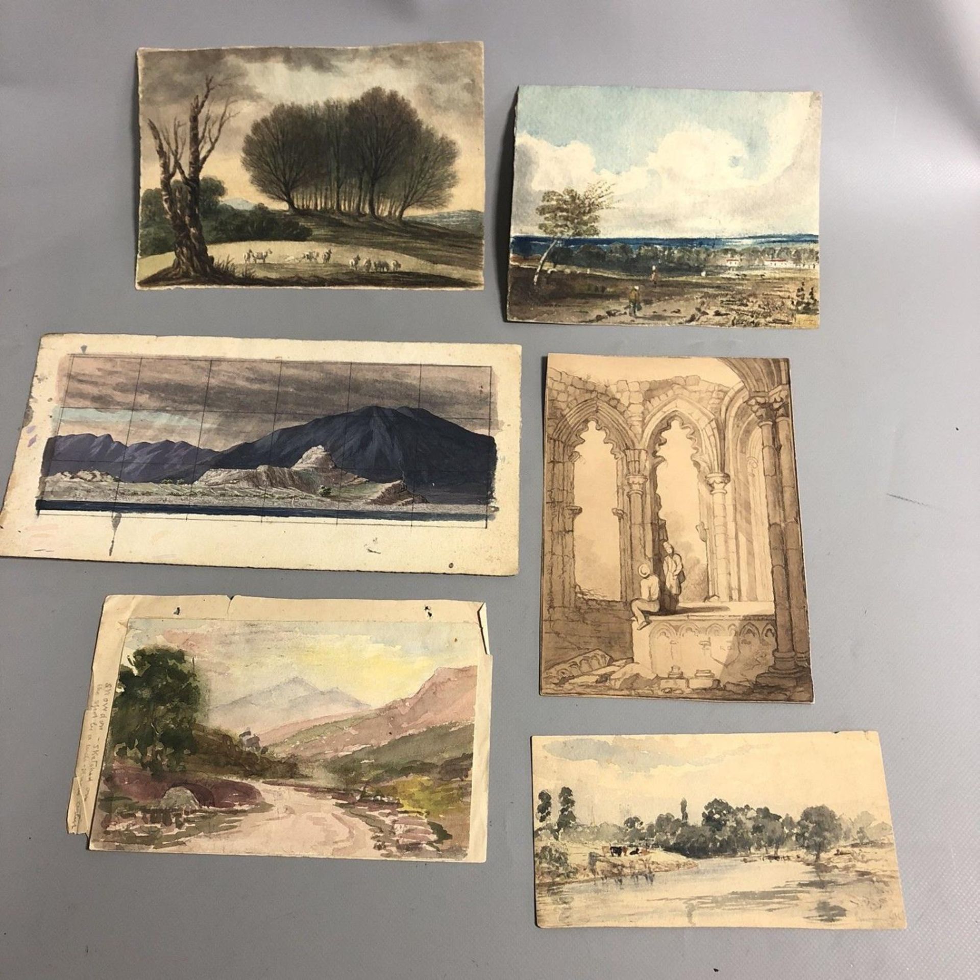 A collection of six unframed unsigned small vintage watercolour paintings