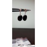 Earrings in white gold with onyx and diamonds