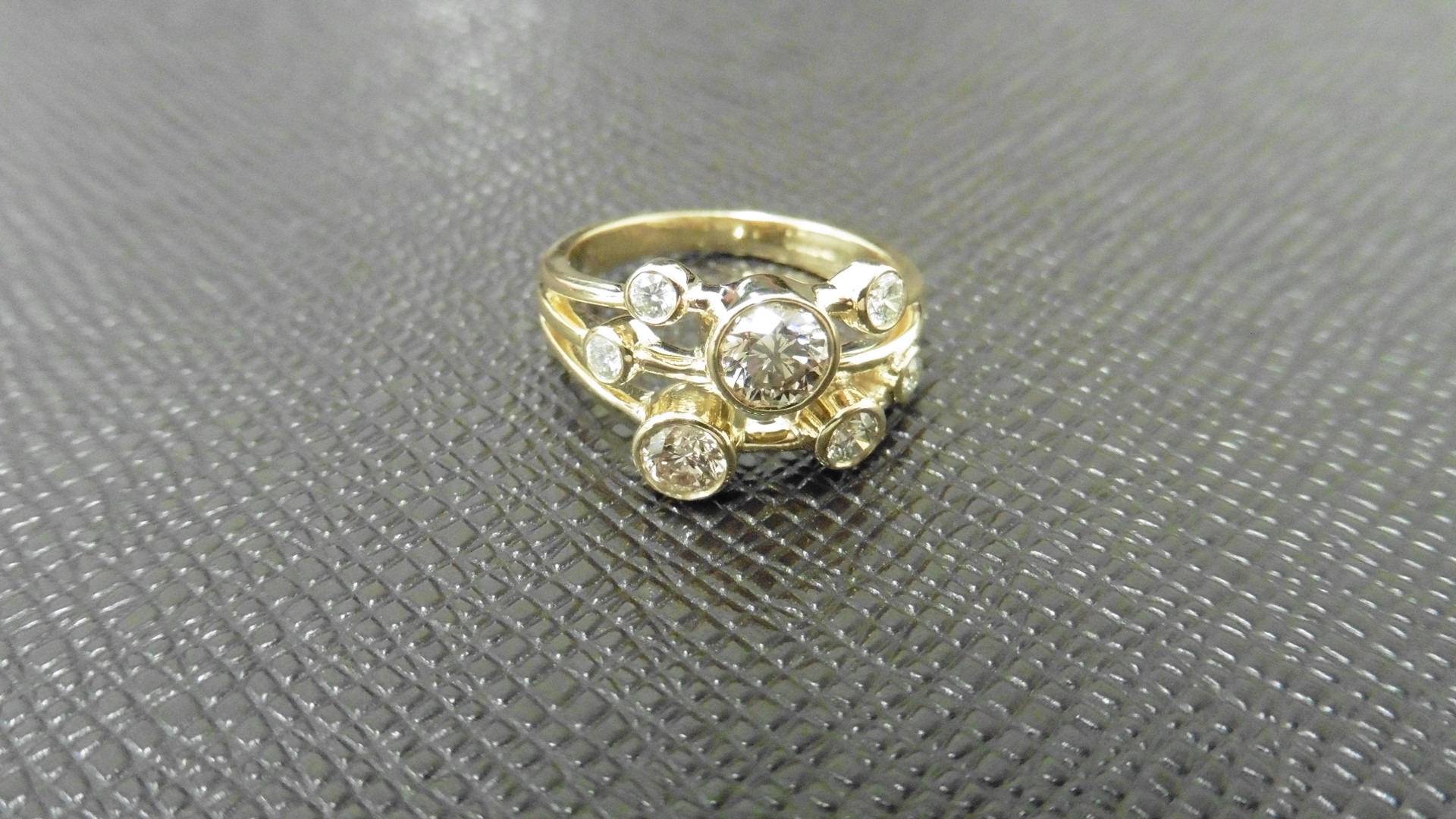 1.00ct 9ct yellow gold diamond dress ring, rain dance style. Set with 7 graduated brilliant cut - Image 2 of 4