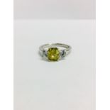 Platinum three stone Diamond ring,1.20ct natural yellow diamond centre,i1 clarity,two 0.50ct round