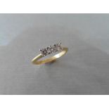 18ct gold diamond three stone ring set with three small brilliant cut diamonds, I colour and Si