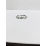 0.60ct diamond band ring set in 14ct white gold. 7 graduated brilliant cut diamonds, I colour and