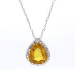 Pear Shaped Diamond and Yellow Sapphire Halo Pendant in Claw Setting