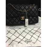 Chanel Black caviar leather jumbo double flap bag