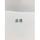 0.70ct diamond solitaire stud earrings set in platinum. I colour, si3 clarity. 3 claw setting with