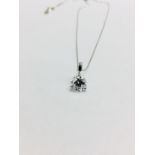 0.70ct diamond solitaire style pendant with a brilliant cut diamond, H colour and si1 clarity. Set