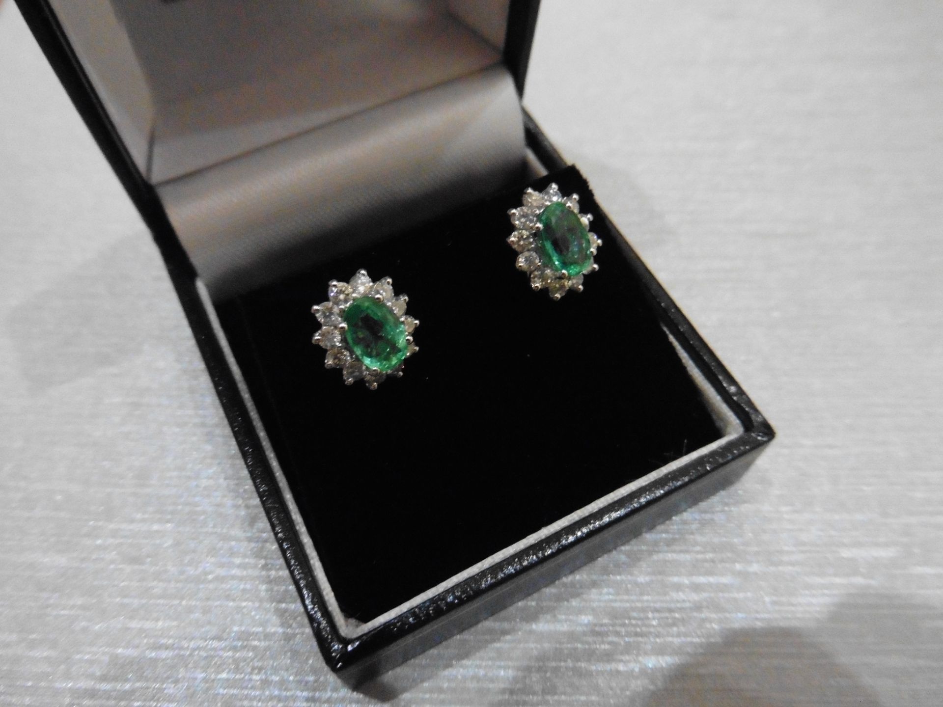 1.60ct emerald and Diamond cluster style stud earrings. Each emerald ( treated ) measures 7mm x - Image 2 of 2