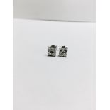 0.50ct diamond cluster style stud earrings. Each set with 4 small brillint cut diamonds, I colour