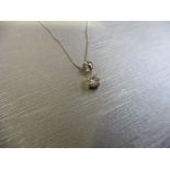 0.15ct diamond solitaire pendant set in 18ct gold. 4 claw setting, plain bale. I colour and si3