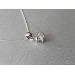 0.20ct diamond solitaire pendant set in 18ct gold. 4 claw setting, plain bale. I colour and si3