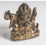 Figur des Mahakala, Tibet, 18./19. Jahrhundert, Bronze feuervergoldet. Sitzende Ausformung, in den