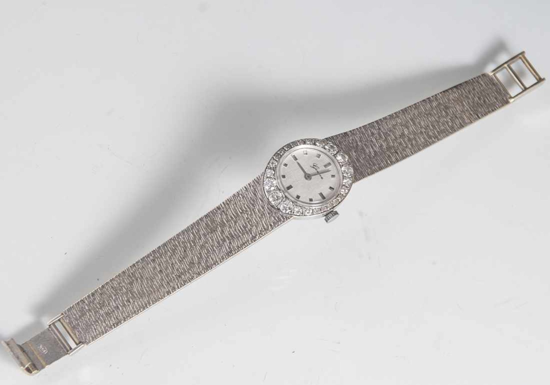 Damenarmbanduhr, Weißgold 750, rundes Gehäuse mit Diamantenlünette, 24 Steine (Brillantvollschliff