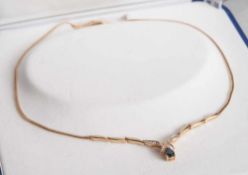 Collier, Gelbgold 585, ausgefasst mit 1 transparenten, dunkelblauen Saphir, tropfenförmig