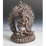 Figur des Mahakala, Tibet, wohl 19. Jahrhundert, Bronze, dunkel patiniert, stehend aufeinem Dämon,