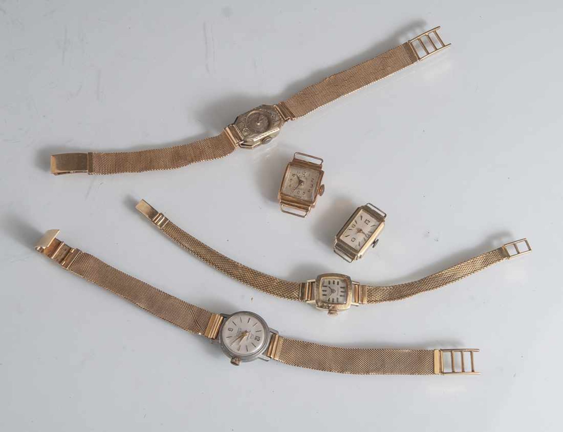 Posten Damenarmbanduhren, Gold 750 und 585, a) rechteckiges Uhrengehäuse, GG 750, mithellem