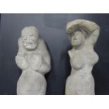 Two heavy carved stone figures in medieval style