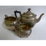 An Edward VII Silver three piece tea set in the late Georgian style,