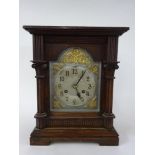 An Edwardian two train mantle clock with brass dial silvered chapter ring