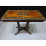 A ebonised inlaid amboyna fold over tea table