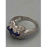 An 18ct white gold sapphire and diamond ring