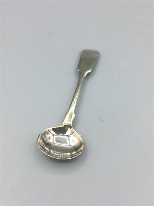 A silver mustard spoon