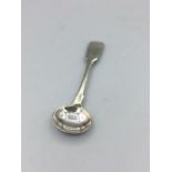 A silver mustard spoon