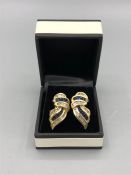 A pair of 14ct yellow gold sapphire and diamond earrings