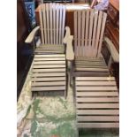 Two steamer chairs with foot stools in light grey