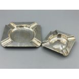 Two square silver ashtrays